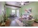 Cozy living room featuring neutral tones, beamed ceilings, modern decor, and ample natural light at 3300 Needles Dr, Orlando, FL 32810