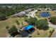 Community park aerial featuring playground, picnic area, and lush landscaping near residences at 3620 Benson Park Blvd, Orlando, FL 32829