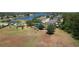 Overhead view of the community park with playground, green spaces, and serene lake backdrop at 3620 Benson Park Blvd, Orlando, FL 32829