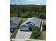 Aerial view of a single-Gathering home showcasing the roof, driveway, and surrounding landscaping at 3620 Benson Park Blvd, Orlando, FL 32829