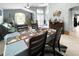 Open floor plan showing the dining room and living room with a view of the front entrance at 3620 Benson Park Blvd, Orlando, FL 32829