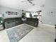 The cozy living room flows into an open kitchen area, and offers tile floors and lots of seating at 3620 Benson Park Blvd, Orlando, FL 32829