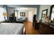 Spacious main bedroom featuring hardwood floors, lots of natural light, and a connected sitting room at 3620 Benson Park Blvd, Orlando, FL 32829
