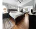 Spacious main bedroom featuring hardwood floors, lots of natural light, and a connected sitting room at 3620 Benson Park Blvd, Orlando, FL 32829