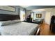 Spacious main bedroom featuring hardwood floors, lots of natural light, and a connected sitting room at 3620 Benson Park Blvd, Orlando, FL 32829