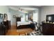 Spacious main bedroom featuring hardwood floors, lots of natural light, and a connected sitting room at 3620 Benson Park Blvd, Orlando, FL 32829