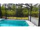 Relaxing screened-in pool area with private backyard views at 3620 Benson Park Blvd, Orlando, FL 32829