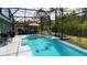 Inviting pool with a seating area and a beautiful view of the backyard at 3620 Benson Park Blvd, Orlando, FL 32829