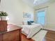 Bright bedroom with hardwood floors, white walls and a ceiling fan at 420 S Oak Ave, Sanford, FL 32771