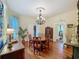 Elegant dining room featuring a round table, chandelier, and detailed ceiling medallion at 420 S Oak Ave, Sanford, FL 32771