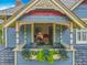 The house boasts a Juliet balcony with seating, an open door and decor at 420 S Oak Ave, Sanford, FL 32771