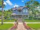 Charming two-story home with a spacious porch and beautiful landscaping at 420 S Oak Ave, Sanford, FL 32771