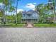 Charming two-story home with a spacious porch and beautiful landscaping at 420 S Oak Ave, Sanford, FL 32771
