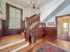 Foyer with wooden staircase, chandelier, and decorative rug at 420 S Oak Ave, Sanford, FL 32771