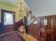 Foyer with hardwood floors, detailed staircase, and a stylish chandelier at 420 S Oak Ave, Sanford, FL 32771