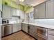Clean kitchen featuring stainless steel appliances, and plentiful cabinetry at 420 S Oak Ave, Sanford, FL 32771