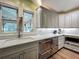 Modern kitchen featuring stainless steel appliances, white countertops, and subway tile backsplash at 420 S Oak Ave, Sanford, FL 32771
