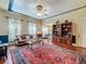 Comfortable living room featuring hardwood floors, a patterned rug and a ceiling fan at 420 S Oak Ave, Sanford, FL 32771