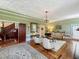 Elegant living room featuring a decorative ceiling, vintage furniture, and hardwood floors at 420 S Oak Ave, Sanford, FL 32771