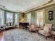 Cozy living room with grand piano, hardwood floors and bay window at 420 S Oak Ave, Sanford, FL 32771