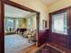 Bright living room with piano, hardwood floors, and wainscoting at 420 S Oak Ave, Sanford, FL 32771