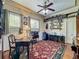 Charming office space featuring vintage desk, built-in shelving, and ample natural light at 420 S Oak Ave, Sanford, FL 32771
