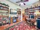 Cozy office space with fireplace, bookshelves, and a classic rug at 420 S Oak Ave, Sanford, FL 32771