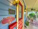 View of the porch with the address plaque and a red front door at 420 S Oak Ave, Sanford, FL 32771