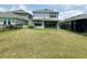 Fenced backyard, with a view of the two story home at 6268 Great Bear Dr, Lakeland, FL 33805