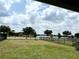 Large backyard features lush greenery and a view of the lake at 6268 Great Bear Dr, Lakeland, FL 33805