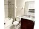 Clean bathroom with a shower/tub combo, toilet, and granite countertop vanity at 6268 Great Bear Dr, Lakeland, FL 33805