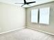 Neutral bedroom with light-colored walls, carpet, ceiling fan, and two windows at 6268 Great Bear Dr, Lakeland, FL 33805