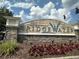 Stone Bridgewater community entrance sign featuring manicured flower beds and lush landscaping at 6268 Great Bear Dr, Lakeland, FL 33805