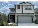 Charming two-story home boasts a two-car garage, landscaped front yard, and a welcoming facade at 6268 Great Bear Dr, Lakeland, FL 33805