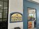 Fitness center sign with the letter W on a blue and beige sign beside a blue door at 6268 Great Bear Dr, Lakeland, FL 33805
