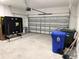 Spacious garage with ample room for storage and activities, featuring a ping pong table and garage door at 6268 Great Bear Dr, Lakeland, FL 33805