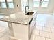 Kitchen island featuring granite countertops, stainless steel appliances and neutral color palette at 6268 Great Bear Dr, Lakeland, FL 33805