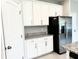 Kitchen features stainless steel refrigerator, granite countertops, and ample storage space at 6268 Great Bear Dr, Lakeland, FL 33805