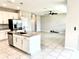 Bright kitchen featuring granite countertops, stainless steel appliances and view to living room at 6268 Great Bear Dr, Lakeland, FL 33805