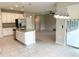Open-concept kitchen with stainless steel appliances, granite countertops and a large island at 6268 Great Bear Dr, Lakeland, FL 33805