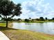 Picturesque lake view surrounded by lush greenery and homes at 6268 Great Bear Dr, Lakeland, FL 33805