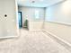 Carpeted upstairs loft with a window and neutral paint, perfect for recreation at 6268 Great Bear Dr, Lakeland, FL 33805
