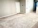 Upstairs loft area featuring neutral walls, white trim, and plush carpeting at 6268 Great Bear Dr, Lakeland, FL 33805