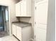 Mudroom featuring granite countertops, white cabinets, with access to additional rooms at 6268 Great Bear Dr, Lakeland, FL 33805