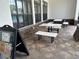 Charming outdoor patio with stone tables and benches, perfect for relaxing or enjoying a meal at 6268 Great Bear Dr, Lakeland, FL 33805