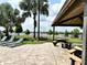 Relaxing community picnic area, with a view of the lake and comfortable lounge chairs at 6268 Great Bear Dr, Lakeland, FL 33805