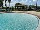 Expansive community pool with beach-style entry, a covered picnic pavilion, and ample seating at 6268 Great Bear Dr, Lakeland, FL 33805