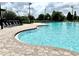 Inviting community pool with plenty of lounge chairs, perfect for relaxation and socializing at 6268 Great Bear Dr, Lakeland, FL 33805