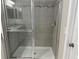 Close-up of the bathroom's glass-enclosed shower featuring tiled walls and modern fixtures at 6268 Great Bear Dr, Lakeland, FL 33805