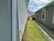 A home's side yard features a well-maintained lawn and a brick pathway between two modern homes at 6268 Great Bear Dr, Lakeland, FL 33805
